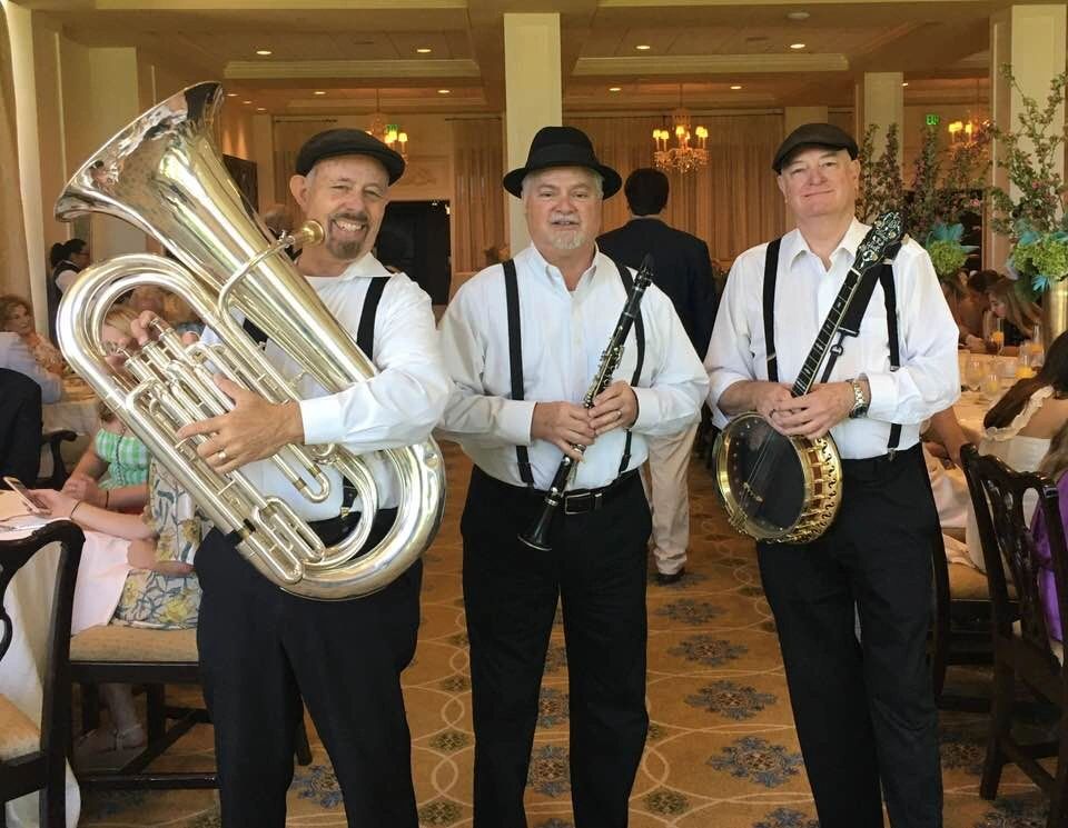 Razzmajazz trio — tuba, clarinet, and banjo at a formal event